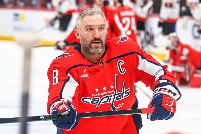 Alex Ovechkin in Capitals gear looking focused during warmups before a game.