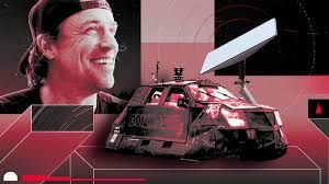 Reed Timmer operating his Dominator 3 vehicle equipped with a satellite dish during a severe weather chase.