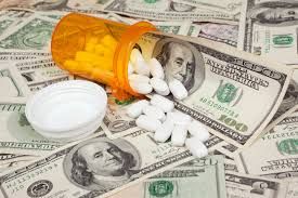 President Donald Trump speaking at a podium with a TrumpRx.gov sign behind him during a drug pricing event.