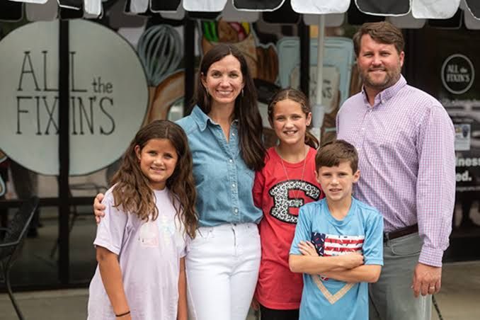 Janna Tucker standing inside her cafe in Statesboro, Georgia, where she serves pecans and prepared meals.