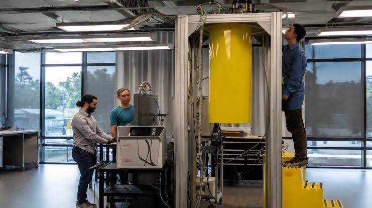Interlune engineers observing a cryogenic separation system designed to extract high-purity helium-3 from industrial gas.