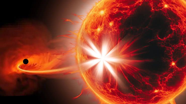 Illustration showing a supermassive black hole stripping material from a star while its binary partner is ejected.