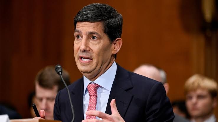 Federal Reserve Chairman Kevin Warsh testifying before a Senate committee regarding monetary policy and AI investment.