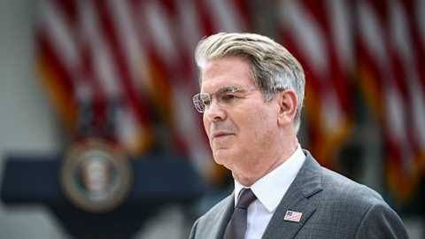Treasury Secretary Scott Bessent speaking at a press event regarding government bond operations.