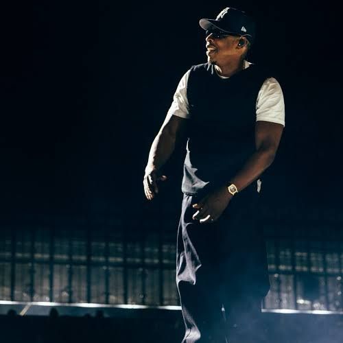 Jay-Z performing on stage at Tottenham Hotspur Stadium before a capacity crowd in London.