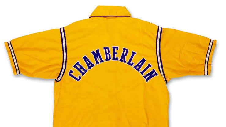 A vintage 1970s Los Angeles Lakers warmup jacket with Chamberlain stitched on the back.
