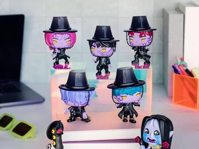 Close-up of Saja Boys Funko vinyl figures from the KPop Demon Hunters series in blind box packaging.