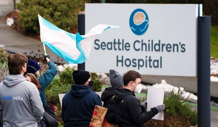Demonstrators gather for a rally in support of trans youth outside Seattle Children's Hospital in February 2025.