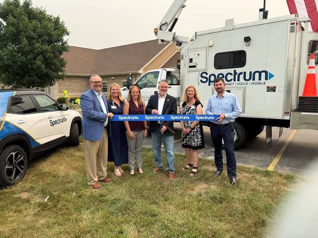 Spectrum and Emplify Health representatives at an event celebrating new fiber broadband infrastructure in Oconto County.