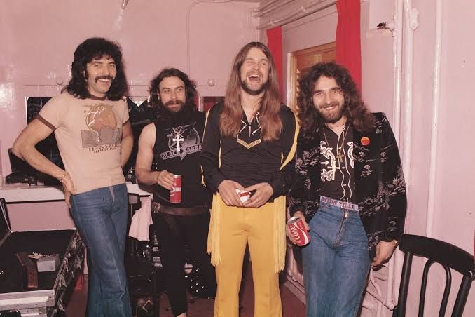 Black Sabbath members pose backstage at the 1973 London Music Festival.