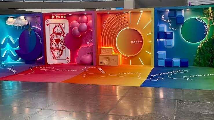 Colorful selfie studio containers with vibrant patterns inside The Streets at Southpoint mall in Durham.
