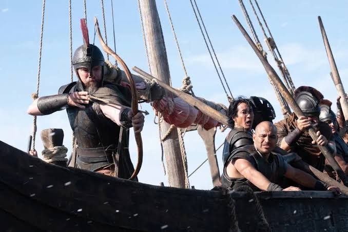 Jimmy Gonzales, Matt Damon, and Himesh Patel appearing in a scene from Christopher Nolan's film The Odyssey.