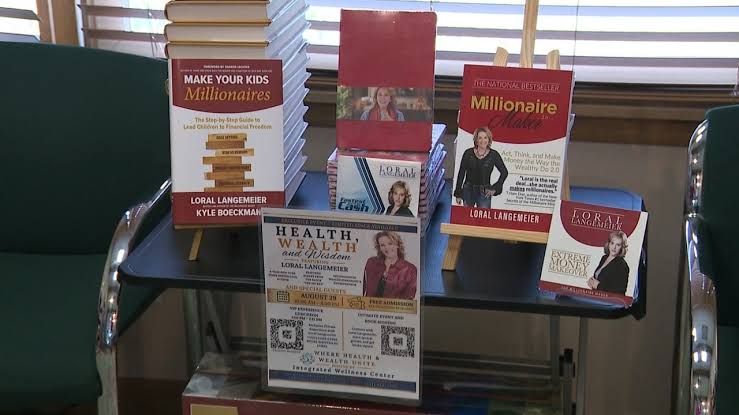 Loral Langemeier speaking at the Integrated Wellness Center in Cortland during a book signing event.