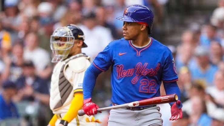 Juan Soto in a New York Mets uniform standing on the field during a game.