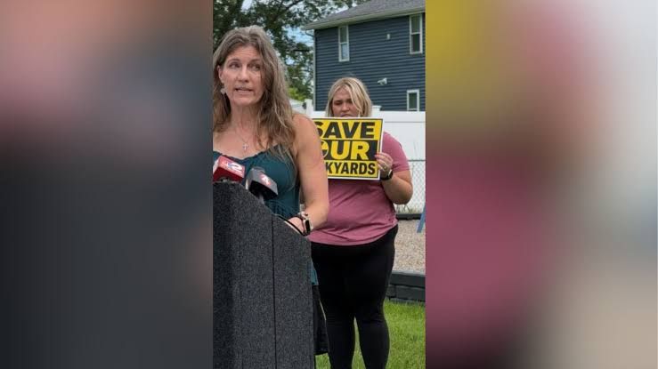 Town of Niagara Supervisor Sylvia Virtuoso and resident Lexi Hawk discussing environmental concerns at a local park event.