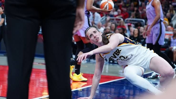 Caitlin Clark drives to the basket before suffering a hard fall during the Fever and Valkyries game.