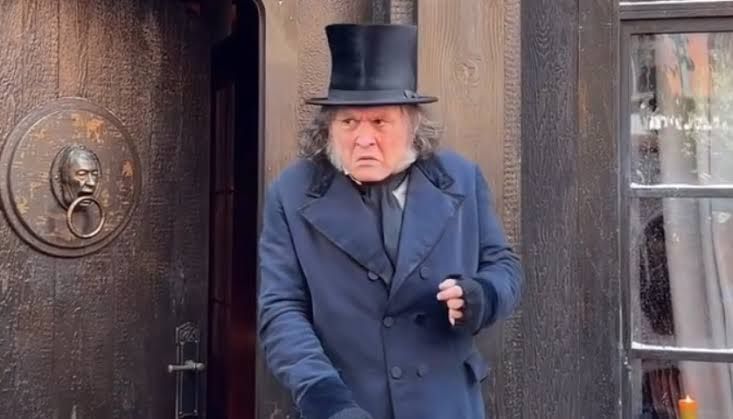Johnny Depp wearing a period-appropriate Scrooge costume and wig during his surprise appearance at Comic-Con 2026.