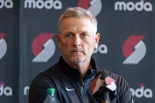 Tom Dundon speaking during a professional sports event press conference.