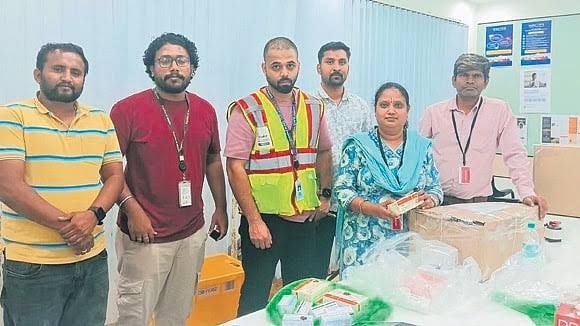 A Karnataka FDA drug inspector examining medicine boxes during a raid on an Amazon-linked storage facility in Bengaluru.