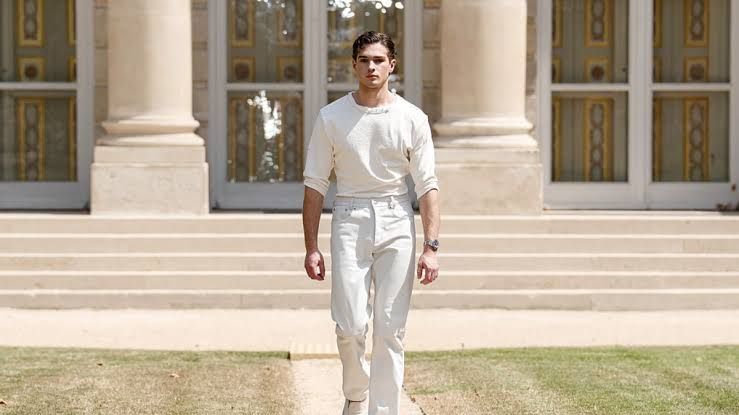 Influencer Clavicular walking the runway at a menswear fashion show in Paris during the summer of 2026.