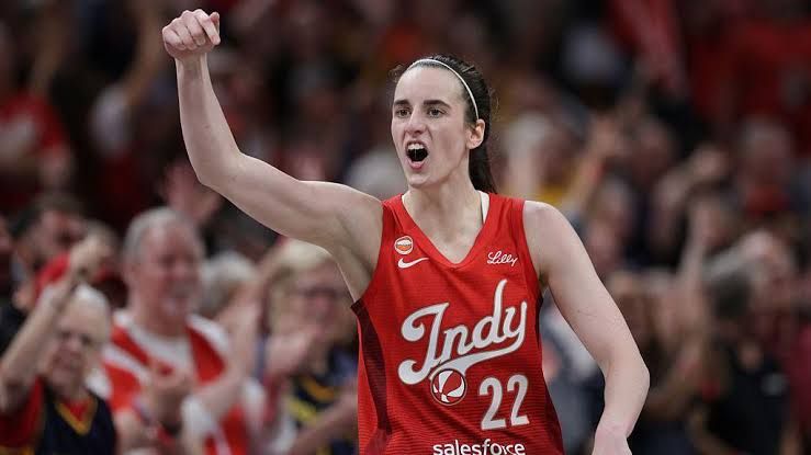 Caitlin Clark celebrating after scoring during the Indiana Fever game against the Seattle Storm.