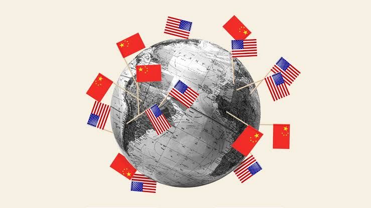 A stylized digital illustration of a computer processor labeled with Chinese and American flags facing off.
