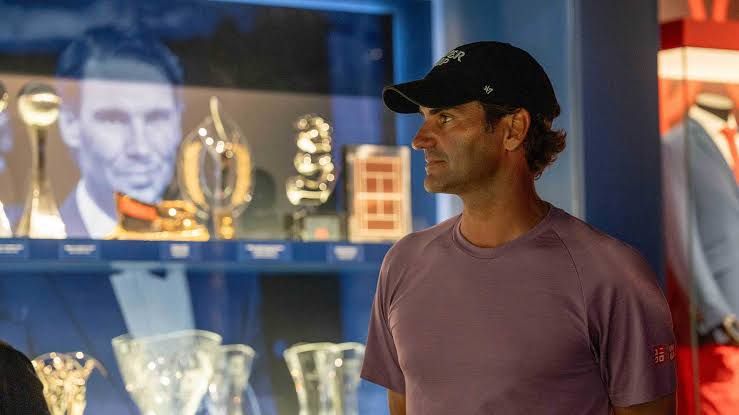 Roger Federer walking through the exhibition halls at the Rafael Nadal Museum in Manacor, Spain.