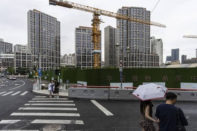 A residential apartment complex under construction in a major Chinese city during the day.