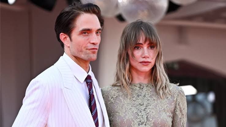 Robert Pattinson and Suki Waterhouse walking at the Venice Film Festival for the premiere of his film Primetime.