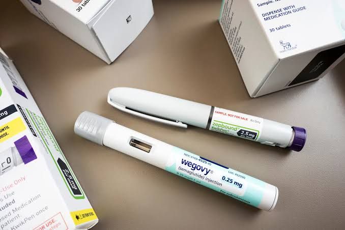 Zepbound KwikPen and Wegovy injection pens positioned side by side for a weight-loss drug comparison.