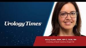 Mary Dunn discussing the role of advanced practice providers in clinical genetic testing at a medical conference.
