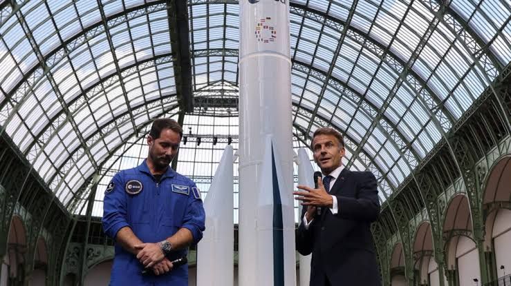 ESA Director General Josef Aschbacher speaking at a podium during the International Space Summit in Paris.