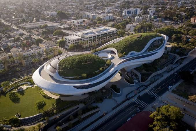 Aerial view of the futuristic Lucas Museum of Narrative Art under construction in Exposition Park.