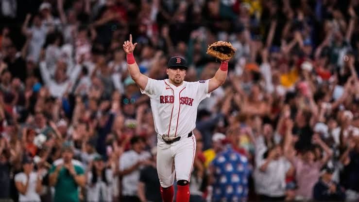Caleb Durbin celebrates a home run near the Fenway Park dugout after beating the Baltimore Orioles.