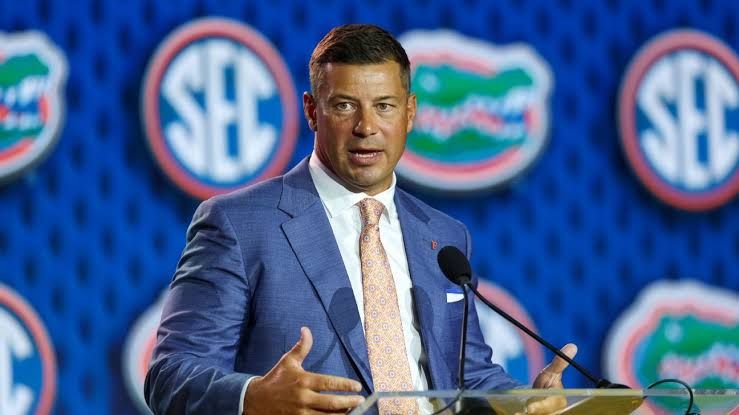 Florida Gators head coach Jon Sumrall speaking during a press conference about the team's upcoming quarterback battle.