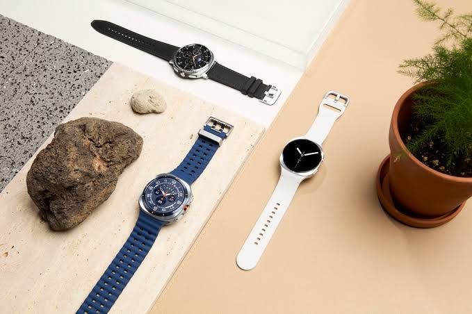 Promotional render showing the Samsung Galaxy Watch 9 in four different colors with Snapdragon Wear Elite branding.