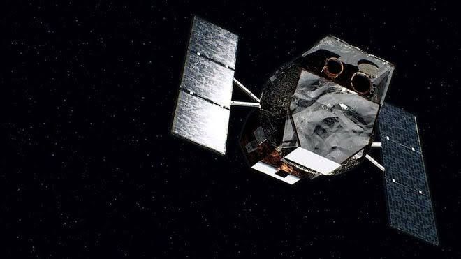 The Swift Observatory satellite in orbit, showing its solar panels and multiwavelength telescope instruments.