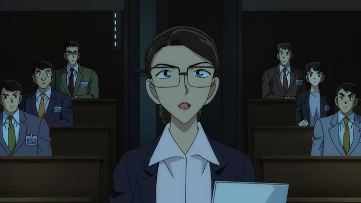 Conan Edogawa stands in a formal setting, representing the 30th anniversary of the Detective Conan anime series.