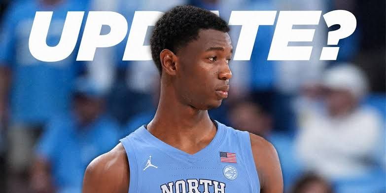 Basketball recruit Sayon Keita standing on the court during a previous high school game.