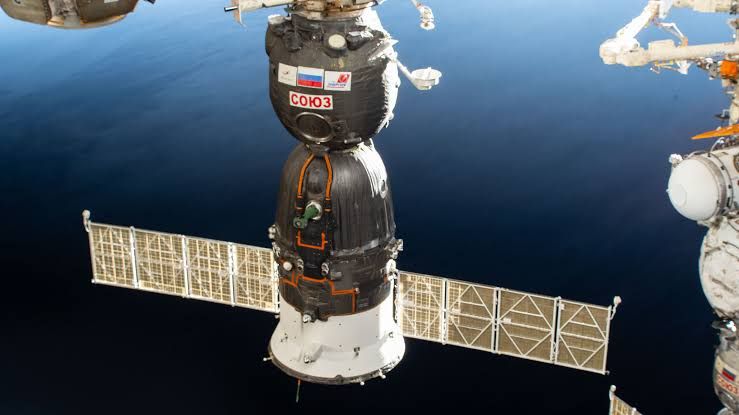 The Soyuz MS-28 spacecraft docked to the International Space Station Rassvet module in space.