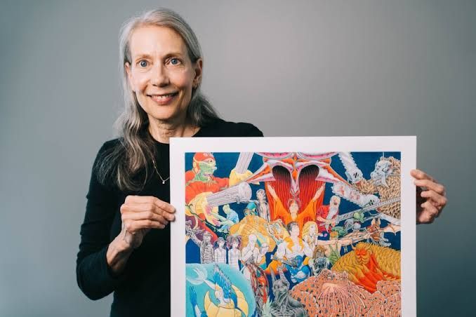 Sharon Turlington holding an illustration by Charles R. Everett at St. Louis Public Radio.