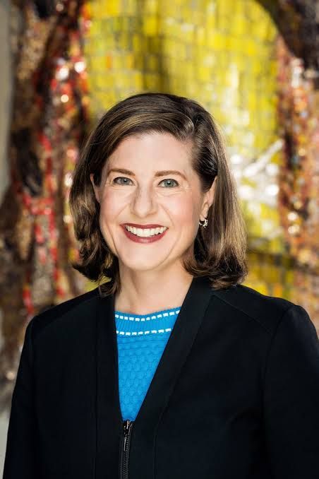 Valerie Hillings standing in a professional setting during her tenure at the North Carolina Museum of Art.
