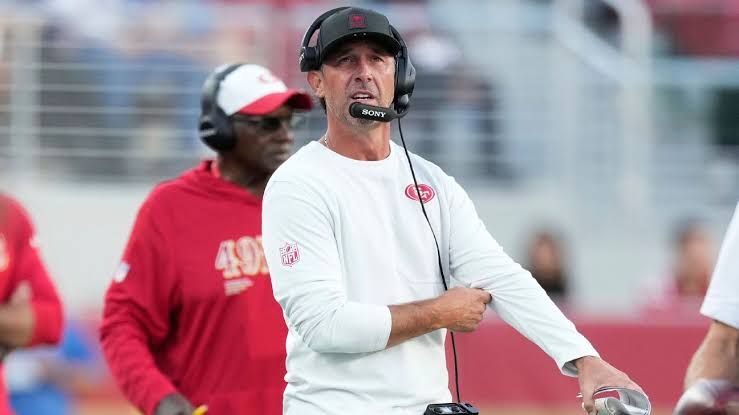 San Francisco 49ers head coach Kyle Shanahan addressing reporters at a press conference.