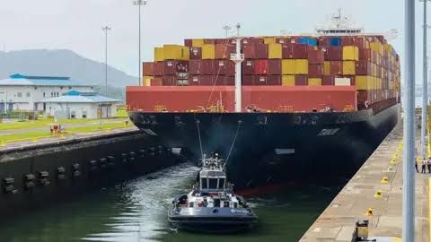 Aerial view of the expanded Panama Canal locks during a commemorative event in Panama City.