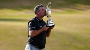 Ryan Fox holds the Claret Jug trophy while smiling after winning the 154th Open Championship at Royal Birkdale.