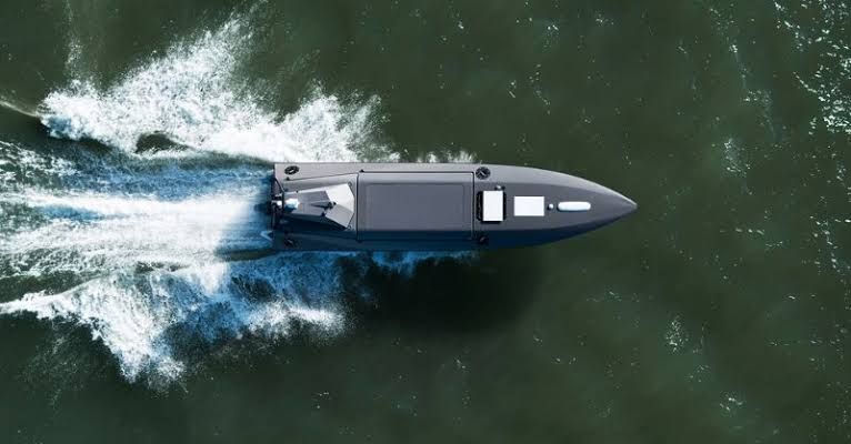 Kraken Technology Group uncrewed surface vessel performing maneuvers in open water for maritime defense exercises.