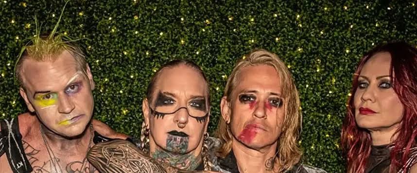 Coal Chamber members performing on stage at a live concert venue.