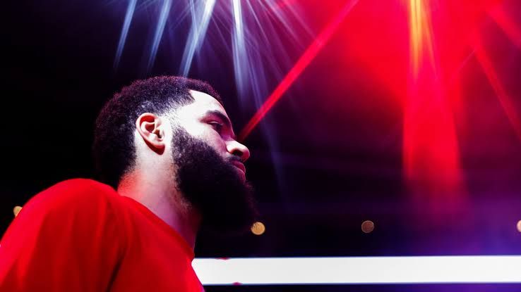 Fred VanVleet and Kevin Durant stand on the court together during a team event for the Houston Rockets.