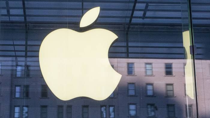 A stylized Apple logo and an OpenAI office sign representing the legal tension between the two technology companies.
