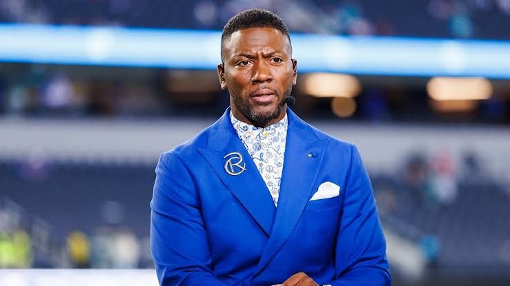 NFL analyst Ryan Clark stands on the field at SoFi Stadium before a Monday Night Football game.